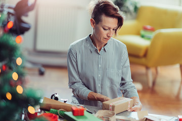 Woman wrapping Christmas presents