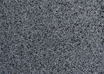 Grey and black fragments of pavement, texture. Background with copy space