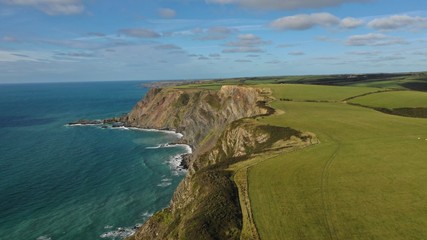 An aerial view over the coast line at Welcombe mouth, Devon. 