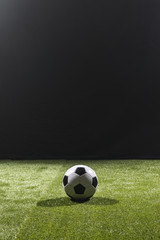 Full shot soccer ball on the pitch