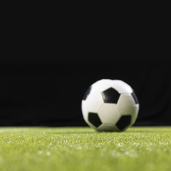 Close-up soccer ball on the pitch