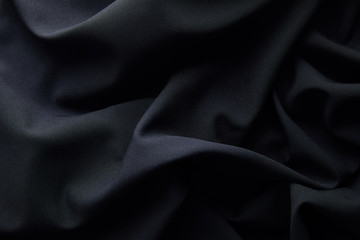 background of black crumpled textured cloth