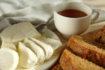 Breakfast of homemade cheese, rye bread,
