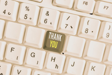 Word writing text Thank You. Business photo showcasing replaying on something good or greetings with pleased way White pc keyboard with empty note paper above white background key copy space