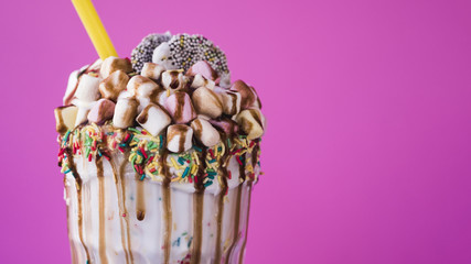 Close-up view of milkshake with marshmallow and chocolate topping