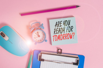 Conceptual hand writing showing Are You Ready For Tomorrow Question. Concept meaning Preparation to the future Motivation Alarm clock notepad clipboard paper markers color background