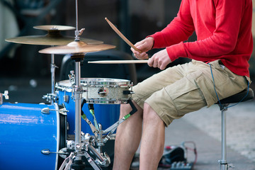 Close-up of playing on drums
