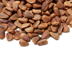 Pine nuts on white background