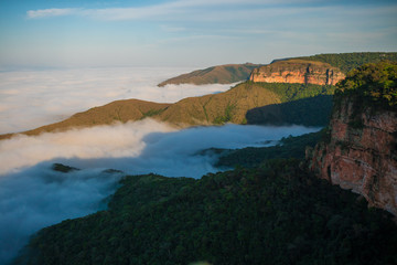 View of the walls and fog of Morro dos Ventos, postcard of the city of Chapada dos Guimarães, Mato Grosso - Brazil