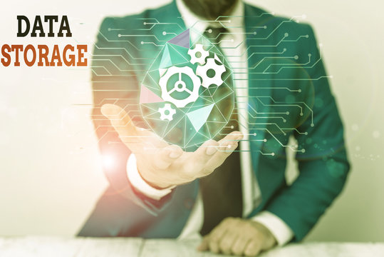 Word writing text Data Storage. Business photo showcasing the act of archiving data in electromagnetic or other forms Male human wear formal work suit presenting presentation using smart device