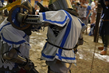 Knights are fighting on the battlefield during the festival 