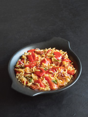 Roasted pepper and chorizo orzo salad combines red peppers, red onion, chorizo and cherry tomatoes with orzo pasta. 