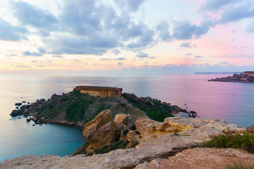 Panorama of Gnejna bay and Golden Bay, themost beautiful beaches in Malta in summer evening with beautiful cloudy sky. Mgarr, Malta.