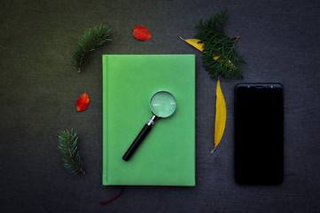 magnifier and notebook