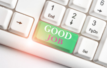 Text sign showing Good Job. Business photo showcasing encourage someone for his effort hard work winning or success White pc keyboard with empty note paper above white background key copy space