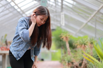 portrait of young woman at botanical garden in japan