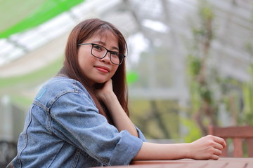 portrait of young woman at botanical garden in japan