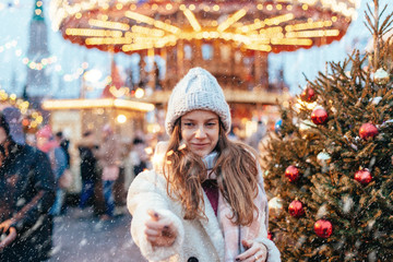 Girl walking on Christmas Market on Red Square in Moscow