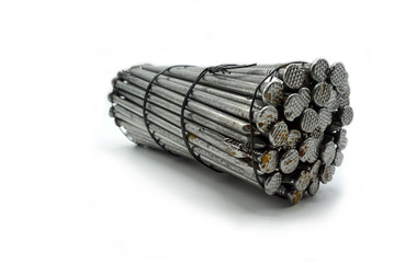 Steel construction nails of different lengths tied together in groups.