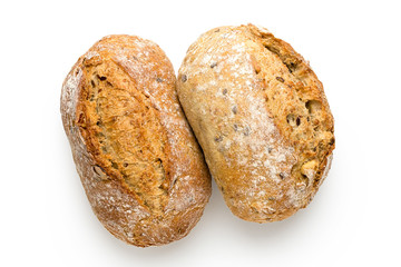 Two whole grain french bread rolls isolated on white. Top view.