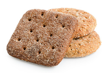 Two round oat wheat flat breads and one square rye flat bread isolated on white.
