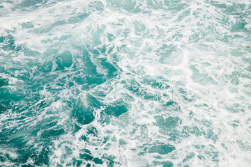 Fototapeta premium Natural background storm sea blue ocean with foam and waves