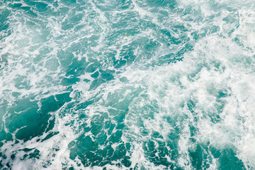 Fototapeta premium Natural background storm sea blue ocean with foam and waves