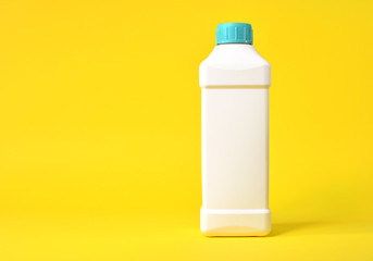 Empty white plastic container on a yellow background
