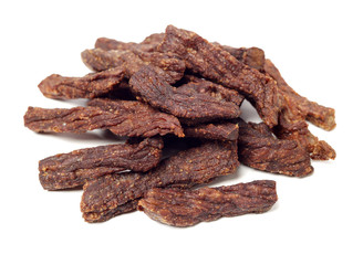 Slices of beef jerky on white background