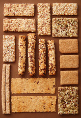 Assorted whole grain pastry snacks with seeds viewed from above. Flat lay. Top view. Chrono and vegetarian diet
