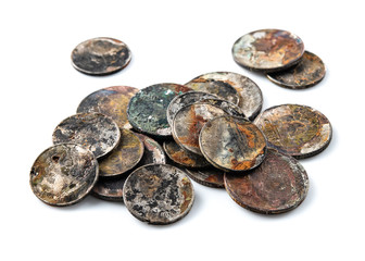 Old rusted coins,Oxidized old coins on white background.
