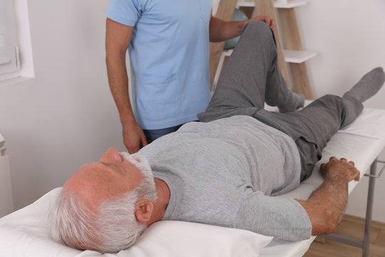Joint Problems, Arthritis Health and Aging. Chiropractic / Osteopathy treatment, knee pain. Physiotherapy for senior male patient