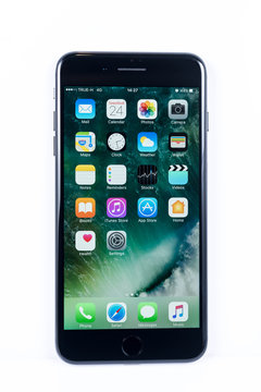 BANGKOK, THAILAND - NOVEMBER 20, 2016: Iphone7 Plus jet black series front view with default home scren on white plain floor, new generation of smartphone, smartphone without headphone jack