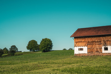 Bavarian scenery with a barn in the fields