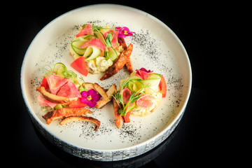 top view on modern potato salad with smoked meat pieces
