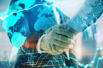 Double exposure of financial chart and world map on cityscape background with two businessmen handshake. Concept of international investment