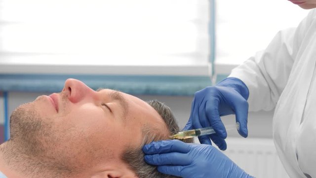 Close-up of male patient while PRP injections procedure