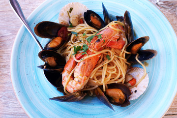 seafood pasta at a restaurant on a rustic table