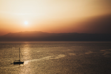 sunset on the sea with a boat in Cabo de Gata
