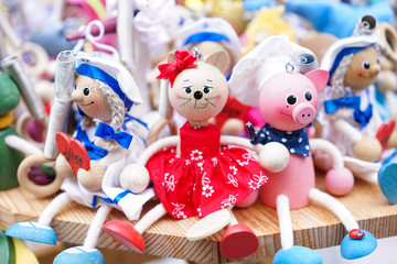 Common souvenirs of animal toys. Wooden animal toys of a chef pig, a cat and a sailor girl. These toys are general souvenirs from the Postojna cave.