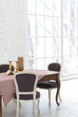 A spacious bright living room with a stylish modern design with elements of antique decor and beautiful chic furniture