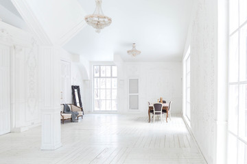 A spacious bright living room with a stylish modern design with elements of antique decor and...