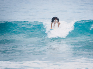 Surfer  pop up on a surfboard. Atlantic Ocean.