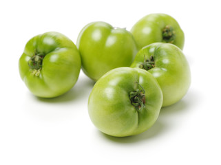 fresh green tomato isolated on white background