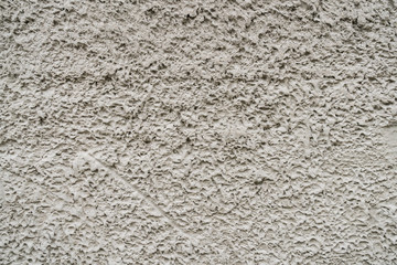 The rough concrete wall texture