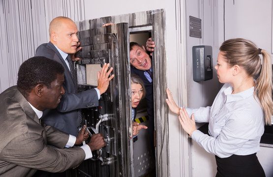 People solving puzzles in escape room