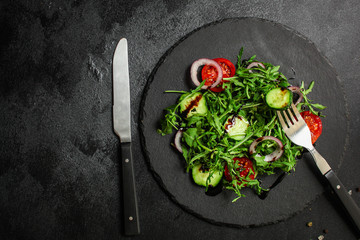Healthy salad, leaves mix salad (mix micro greens, cucumber, tomato, onion, other ingredients). food background. copy space