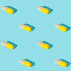 Seamless texture pattern. Pills in capsule on a green background. Set. Long harsh shadow from the summer sunshine