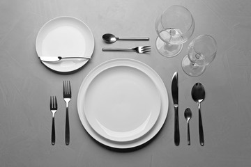 Elegant table setting on grey background, flat lay - Powered by Adobe