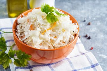 Homemade Sauerkraut with seasonings in an orange bowl. Natural Probiotics, Healthy Food